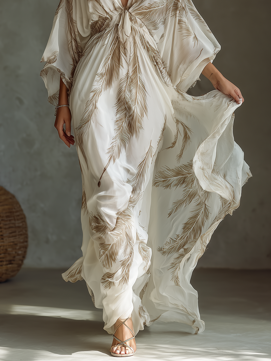 Vestido largo de gasa marfil y topo con mangas murciélago, delantero cruzado y estampado de hojas de palmera