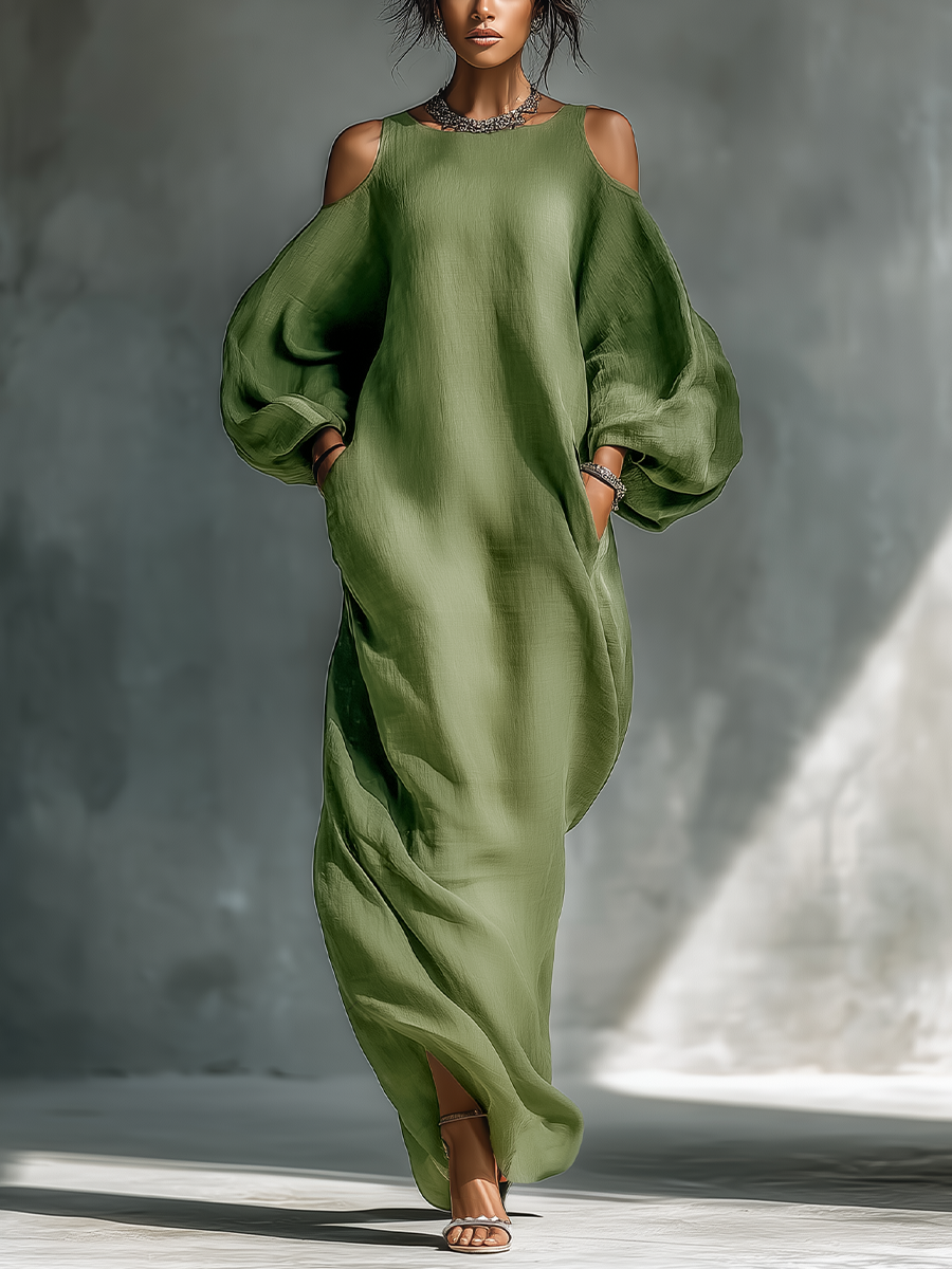 Vestido largo verde claro de hombros descubiertos con mangas abullonadas oversize y bolsillos laterales