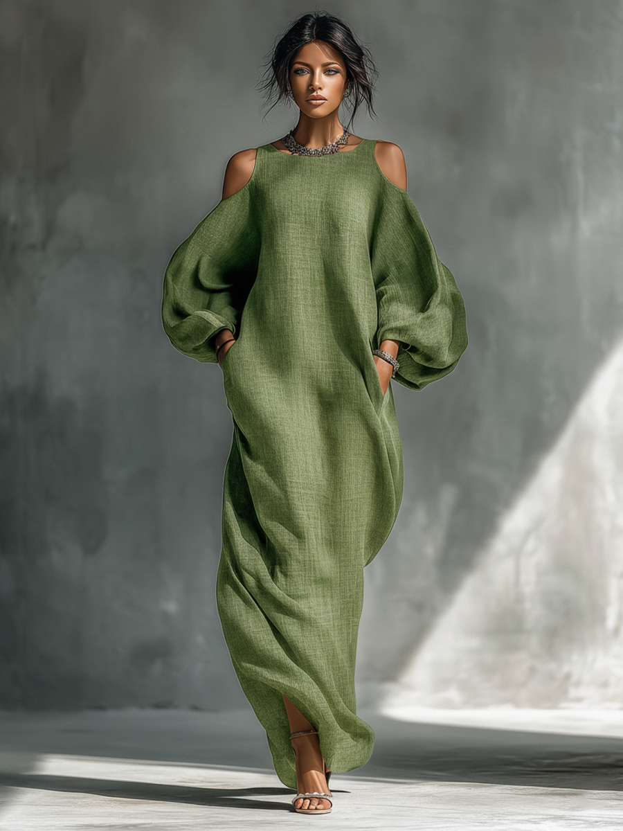 Vestido largo verde claro de hombros descubiertos con mangas abullonadas oversize y bolsillos laterales