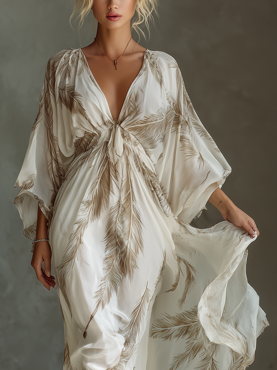 Vestido largo de gasa marfil y topo con mangas murciélago, delantero cruzado y estampado de hojas de palmera