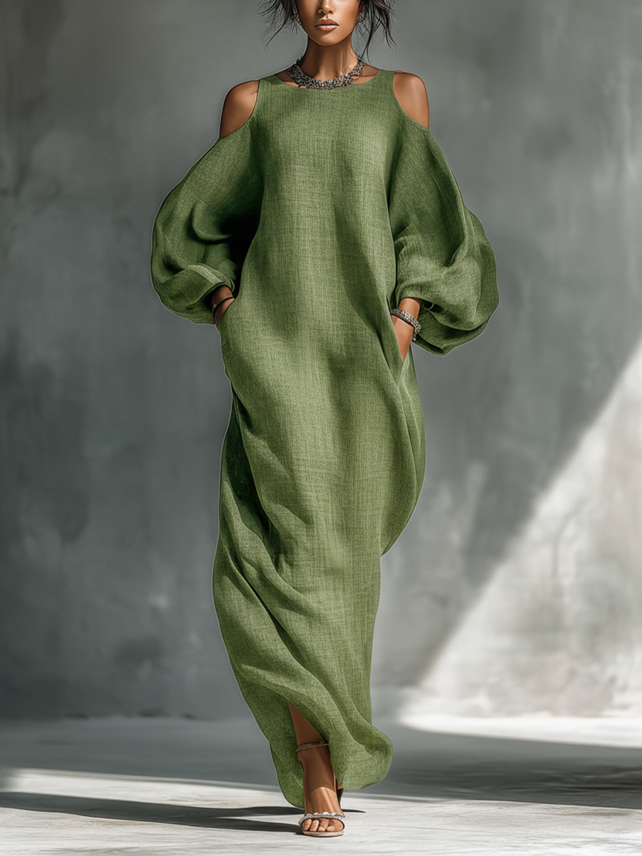 Vestido largo verde claro de hombros descubiertos con mangas abullonadas oversize y bolsillos laterales