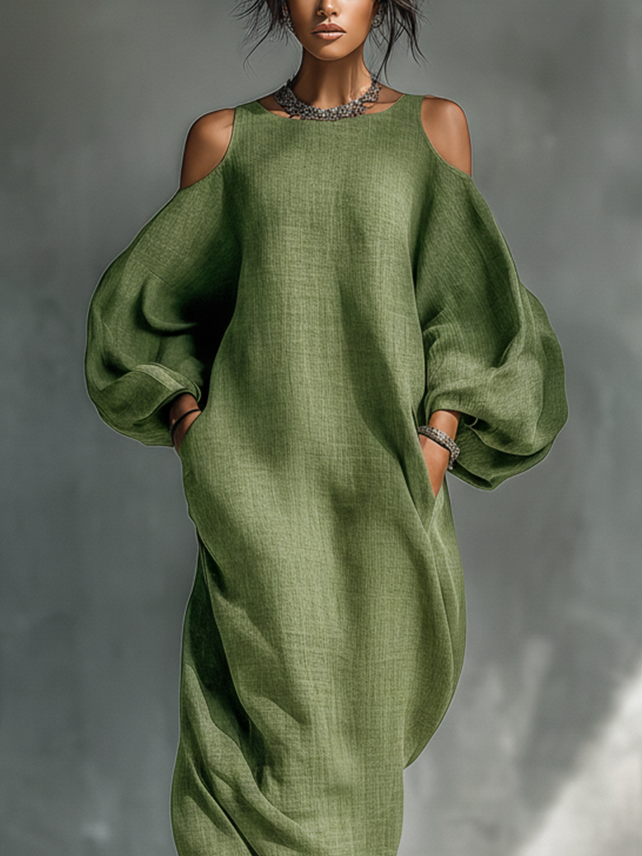 Vestido largo verde claro de hombros descubiertos con mangas abullonadas oversize y bolsillos laterales