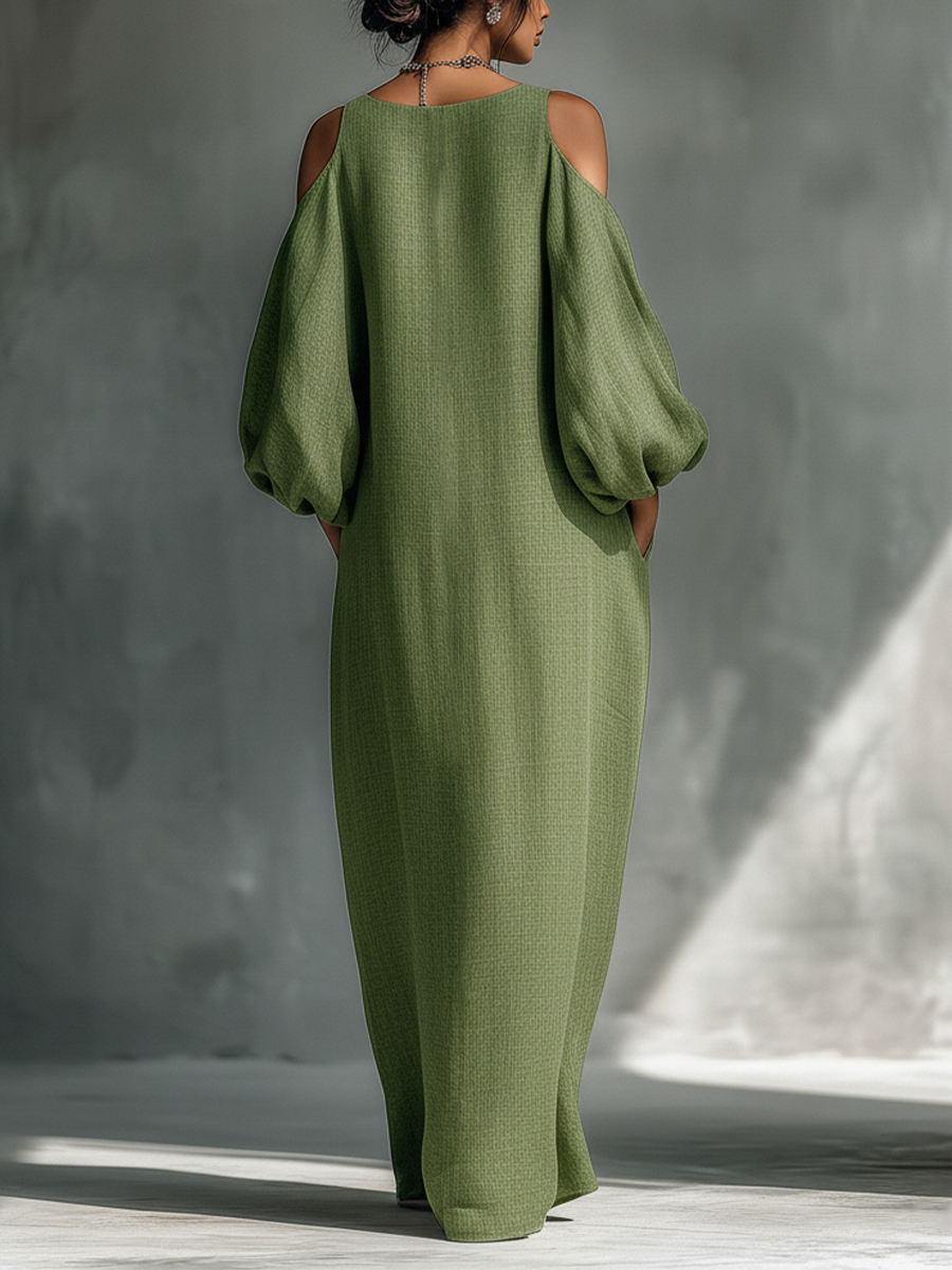 Vestido largo verde claro de hombros descubiertos con mangas abullonadas oversize y bolsillos laterales