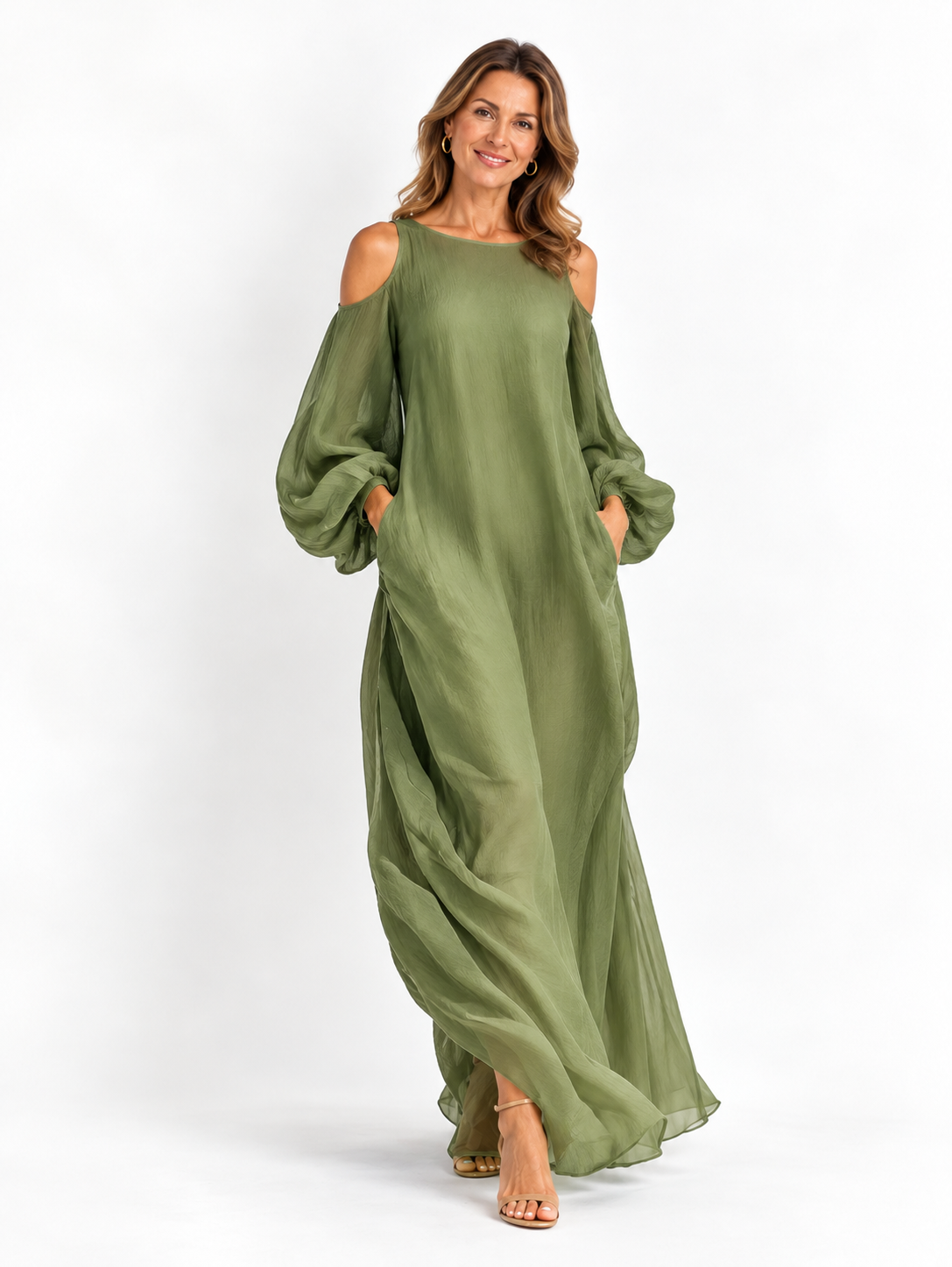 Vestido largo verde claro de hombros descubiertos con mangas abullonadas oversize y bolsillos laterales