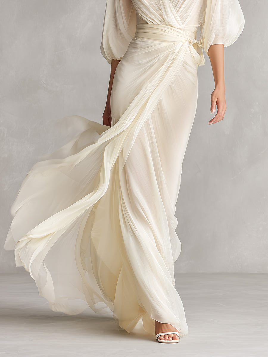 Vestido de gasa transparente marfil con mangas voluminosas y detalle cruzado, estilo romántico y lujoso atemporal