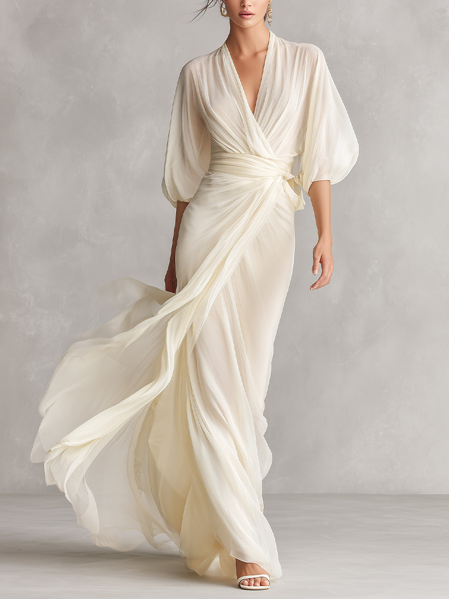 Vestido de gasa transparente marfil con mangas voluminosas y detalle cruzado, estilo romántico y lujoso atemporal